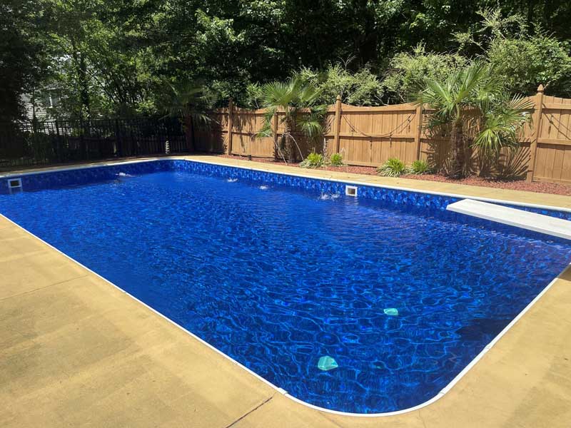 Unique looking pool with a series of straight sides, with deep blue water